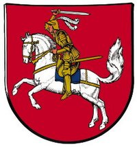 Wappen des Kreises Dithmarschen auf rotem Grund, das Bild eines sein Schwert schwingenden Mannes in Rüstung auf einem Schimmel